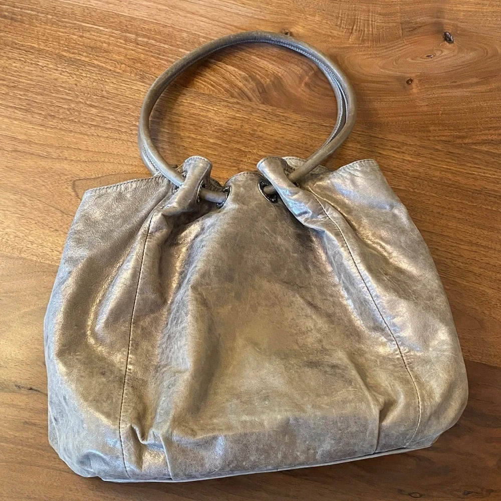 Michael Kors East West Ring Bag in a metallic, distressed leather